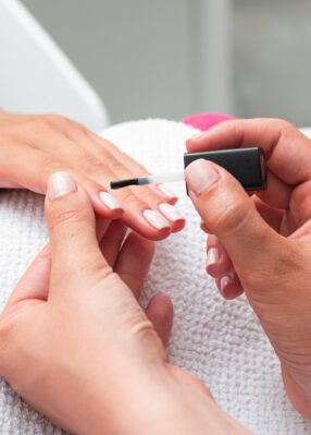 high-angle-woman-doing-manicure-client high-angle-woman-doing-manicure-client
